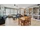Comfortable living room with wood floors, large windows, and built-in shelving at 5838 Cypress Hill Rd, Winter Garden, FL 34787