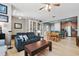 Spacious open-concept living area featuring modern decor and seamless flow to kitchen at 5838 Cypress Hill Rd, Winter Garden, FL 34787