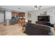 Open-concept living area flows into a kitchen with sleek countertops and stainless steel appliances at 5838 Cypress Hill Rd, Winter Garden, FL 34787
