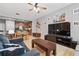 Stylish living area with modern decor, wood floors, and an open layout to the kitchen at 5838 Cypress Hill Rd, Winter Garden, FL 34787