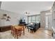 Bright living room featuring wood floors, neutral walls, and a cozy seating area at 5838 Cypress Hill Rd, Winter Garden, FL 34787