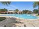 Spacious community pool features ample seating, umbrellas, and a clubhouse at 5838 Cypress Hill Rd, Winter Garden, FL 34787