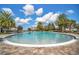 Resort-style pool features a large sundeck and lush landscaping with palm trees at 5838 Cypress Hill Rd, Winter Garden, FL 34787