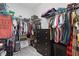 Walk-in closet with clothing, shelving and a chest of drawers to maximize storage at 5838 Cypress Hill Rd, Winter Garden, FL 34787