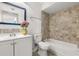 Bathroom featuring a shower-tub combo with tile surround and new vanity at 6178 Westgate Dr # 101, Orlando, FL 32835