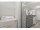 View of the kitchen with updated appliances and laundry area at 6178 Westgate Dr # 101, Orlando, FL 32835