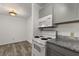 This kitchen boasts updated cabinets, granite countertops, and modern appliances at 6178 Westgate Dr # 101, Orlando, FL 32835
