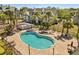 Aerial view of the community pool, spa, and surrounding landscaping at 6178 Westgate Dr # 101, Orlando, FL 32835