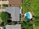 Overhead shot of a home with a private, landscaped pool and deck area in a serene, tree-filled backyard at 623 Green Meadow Ave, Maitland, FL 32751