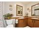 Bathroom featuring double sinks, wood cabinetry, and tile flooring at 623 Green Meadow Ave, Maitland, FL 32751