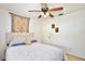 Comfortable bedroom features a queen-sized bed, ceiling fan, and carpeted floors at 623 Green Meadow Ave, Maitland, FL 32751