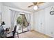 Bedroom featuring a desk, a sliding door to the patio, and white louvered closet doors at 623 Green Meadow Ave, Maitland, FL 32751
