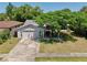 Charming home featuring a well-maintained lawn, mature trees, and an inviting entrance at 623 Green Meadow Ave, Maitland, FL 32751