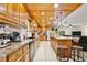 Spacious kitchen featuring oak cabinets, granite countertops, and stainless-steel appliances; ideal for any home chef at 623 Green Meadow Ave, Maitland, FL 32751