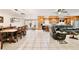 Open-concept kitchen, dining, and living area with tile flooring, creating a spacious and inviting atmosphere at 623 Green Meadow Ave, Maitland, FL 32751