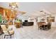 Expansive living space with tiled floors, seamlessly integrating the kitchen, dining area, and living room at 623 Green Meadow Ave, Maitland, FL 32751