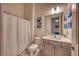 Cozy bathroom with a shower/tub combination, toilet, vanity, and neutral color scheme at 6301 Sand Skipper Rd, Orlando, FL 32821