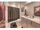 This bathroom is Harry Potter themed, including a character wall print and shower curtain, plus a modern vanity at 6301 Sand Skipper Rd, Orlando, FL 32821