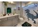 Bright bathroom featuring a gray vanity with a white countertop and T-Rex themed shower curtain at 6301 Sand Skipper Rd, Orlando, FL 32821