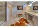 Modern bathroom with double vanity, a lion portrait, and a tiled walk-in shower at 6301 Sand Skipper Rd, Orlando, FL 32821