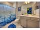 Bathroom featuring a single vanity and a shower with a blue patterned curtain at 6301 Sand Skipper Rd, Orlando, FL 32821