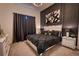 Stylish bedroom with dark accent wall, decorative lighting, and modern furniture at 6301 Sand Skipper Rd, Orlando, FL 32821