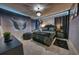 Stylized bedroom featuring a black color palette with accent lighting and Maleficent-themed decor at 6301 Sand Skipper Rd, Orlando, FL 32821