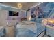 Enchanting bedroom featuring cartoon themed walls, a comfortable bed, and soft lighting at 6301 Sand Skipper Rd, Orlando, FL 32821