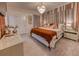 Cozy bedroom featuring soft lighting, elegant drapery, and comfortable decor at 6301 Sand Skipper Rd, Orlando, FL 32821
