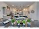 Elegant dining room with a long table, modern decor, and an open view to the kitchen at 6301 Sand Skipper Rd, Orlando, FL 32821