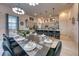Dining area showcasing a dining table with tableware and seating for twelve at 6301 Sand Skipper Rd, Orlando, FL 32821