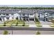 Street view of modern two-story home with landscaped front yard and private driveway at 6301 Sand Skipper Rd, Orlando, FL 32821