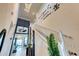 Bright foyer featuring an open staircase with Walt Disney decal, striking light fixture, and elegant zebra rug at 6301 Sand Skipper Rd, Orlando, FL 32821
