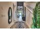 Inviting foyer features a zebra rug and staircase leading to the second floor at 6301 Sand Skipper Rd, Orlando, FL 32821