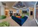 Large cartoon themed game room with custom ceiling, bright walls and comfortable seating at 6301 Sand Skipper Rd, Orlando, FL 32821