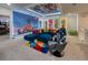 Living room with bright accents, Disney theme, stylish furnishings, and a comfortable atmosphere at 6301 Sand Skipper Rd, Orlando, FL 32821