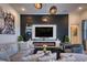 Stylish living room featuring a fireplace, plush seating, accent lighting, and modern décor at 6301 Sand Skipper Rd, Orlando, FL 32821