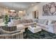 Inviting living room featuring an ample sectional couch, decorative pillows, and a modern coffee table at 6301 Sand Skipper Rd, Orlando, FL 32821