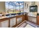 The outdoor kitchen features stainless steel appliances, a built-in grill, and plenty of counter space at 6301 Sand Skipper Rd, Orlando, FL 32821
