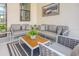 Comfortable outdoor seating area with plush cushions, a rug, and a view of the backyard at 6301 Sand Skipper Rd, Orlando, FL 32821