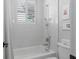 Bright bathroom featuring a tub/shower combination with white tile surround and modern fixtures, perfect for a clean spa feel at 709 Cricklewood Ter, Lake Mary, FL 32746