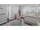 Serene bedroom featuring a canopy bed, cozy chair, and elegant decor; designed for comfort and relaxation at 709 Cricklewood Ter, Lake Mary, FL 32746
