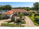 Beautiful single-story home featuring a terra cotta roof, manicured landscaping, and a paver driveway at 709 Cricklewood Ter, Lake Mary, FL 32746