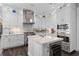 Well-equipped kitchen with a center island, stainless steel appliances, and custom cabinetry at 709 Cricklewood Ter, Lake Mary, FL 32746