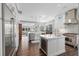 Open-concept kitchen with stainless steel appliances, white cabinetry, and a large center island at 709 Cricklewood Ter, Lake Mary, FL 32746