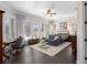 Comfortable main bedroom with hardwood floors, neutral walls, shuttered windows, and sitting area at 709 Cricklewood Ter, Lake Mary, FL 32746