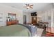 Well-lit main bedroom with a TV, a sitting area, hardwood floors, and multiple windows at 709 Cricklewood Ter, Lake Mary, FL 32746