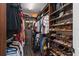 Spacious walk-in closet with custom shelving for clothes, shoes, and accessories at 709 Cricklewood Ter, Lake Mary, FL 32746