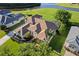 Overhead shot of a home showing off the spacious backyard, screened-in patio, and water access at 7351 Spring Mountain Ln, Yalaha, FL 34797