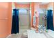 Bathroom with decorative lighting, a vanity, and a shower and tub combo at 7351 Spring Mountain Ln, Yalaha, FL 34797